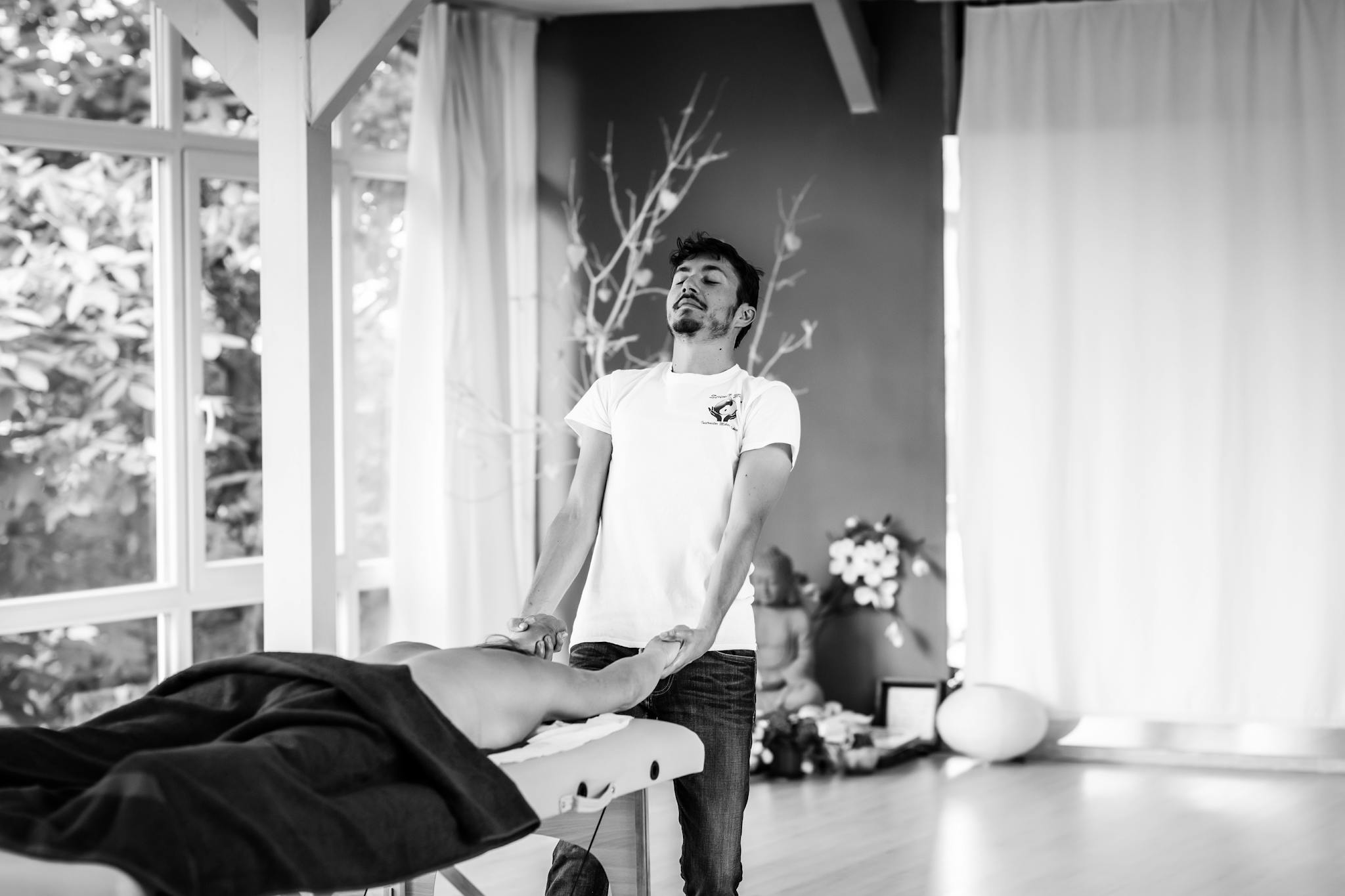 A relaxing massage session with a focus on wellness and tranquility in a serene setting.