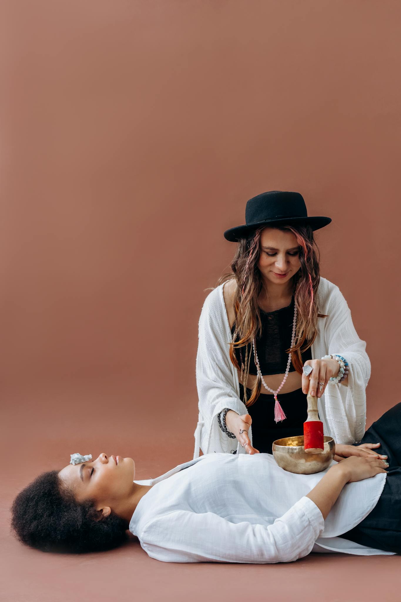 Woman Practicing Sound Healing With A Tibetan